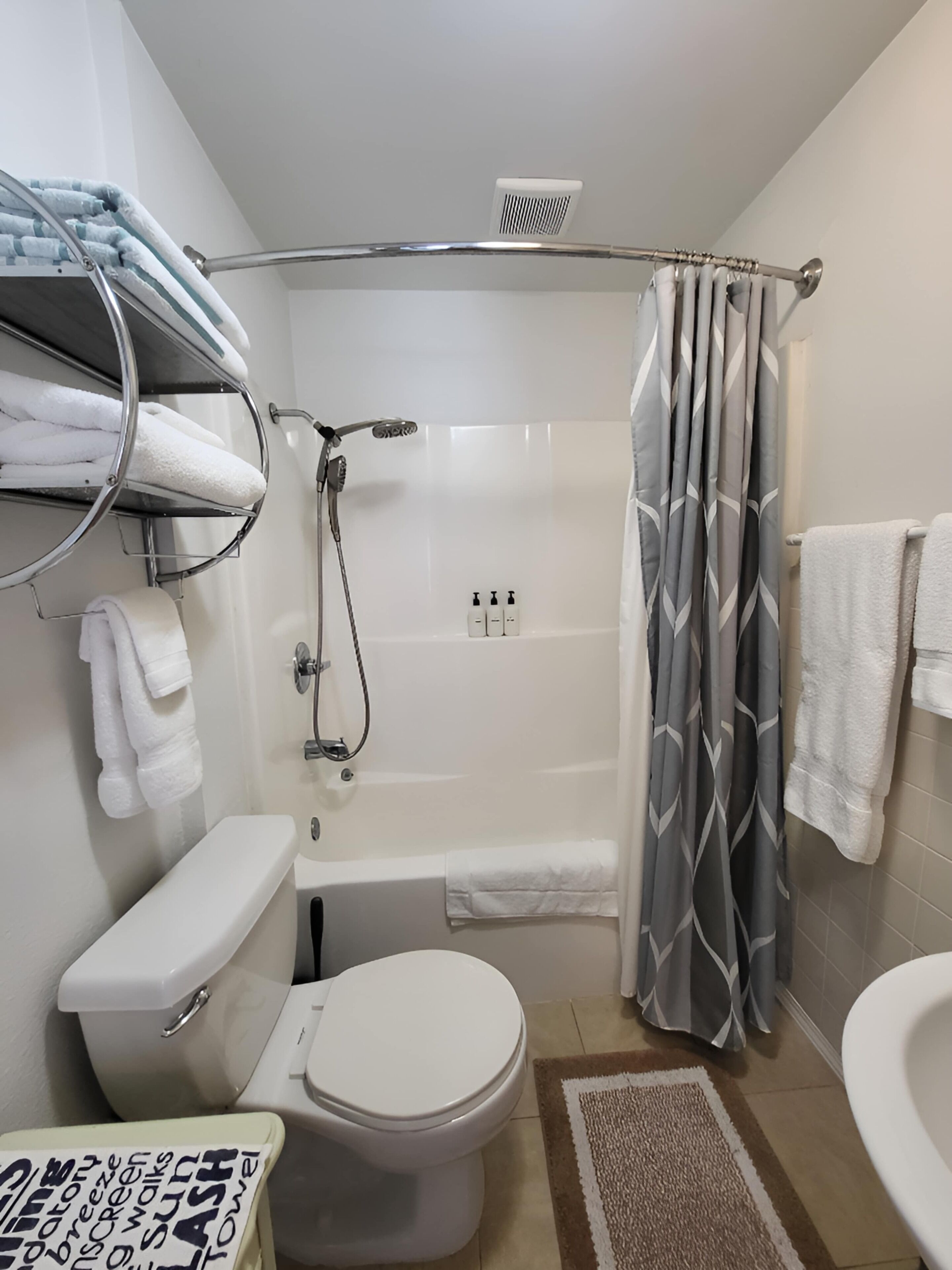Shower, hair dryer, towels, shampoo