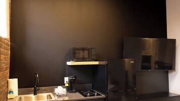 Microwave, stovetop, coffee/tea maker, cookware/dishes/utensils