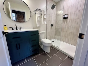 Shower, hair dryer, towels, soap