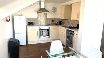 Apartment, Balcony, Courtyard View | Private kitchen | Full-sized fridge, microwave, oven, stovetop