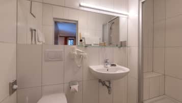 Shower, hair dryer, towels, toilet paper