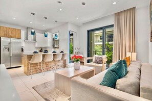 Family Condo, Balcony, Pool View | Living area | Smart TV - Wariruri Condos by SunStays (Noord)