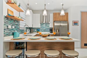 Superior Condo, 1 King Bed, Ground Floor | Private kitchen | Full-size fridge, microwave, oven, stovetop