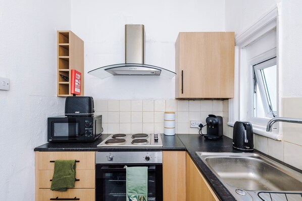 Fridge, stovetop, cookware/dishes/utensils, spices