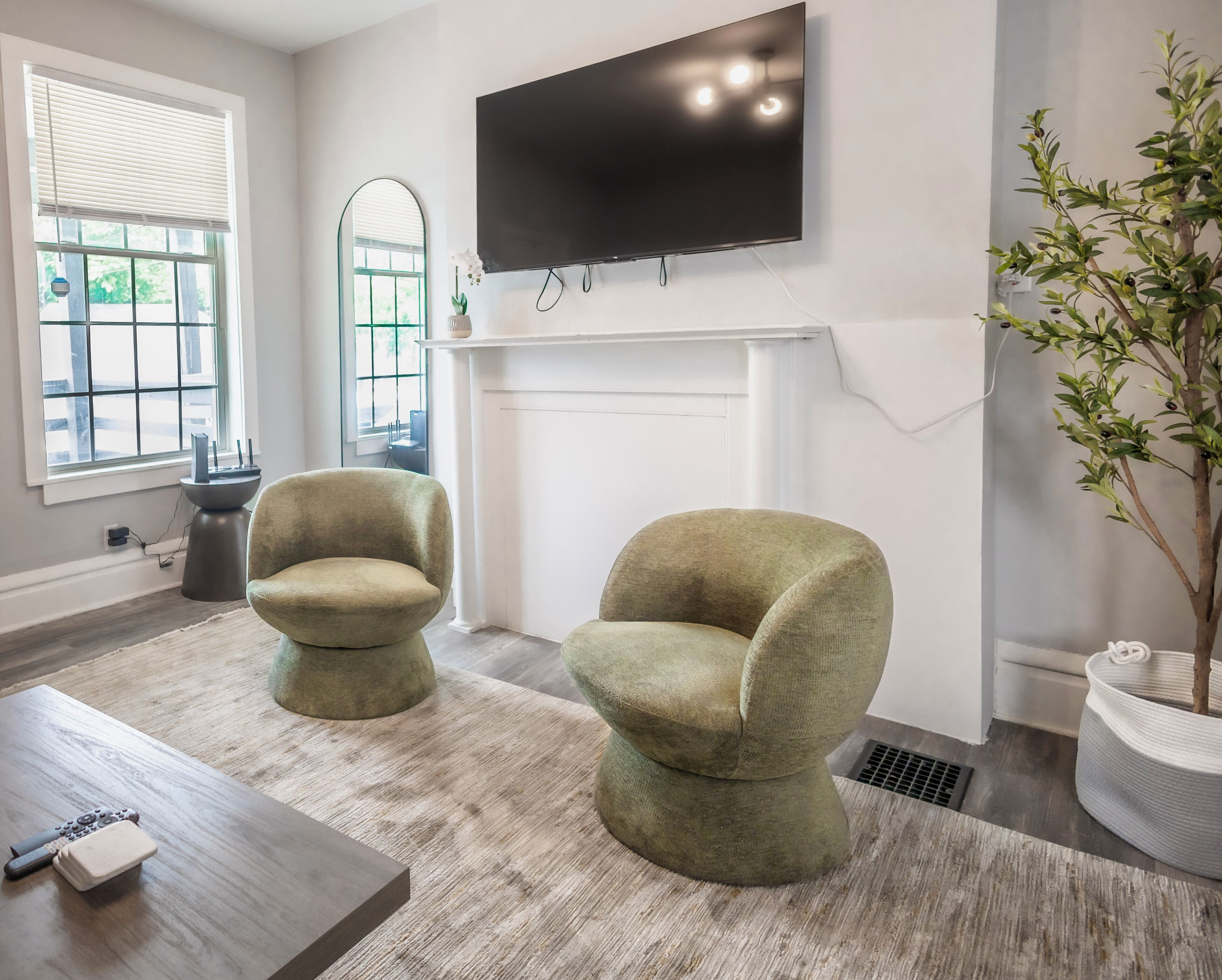 Bright and inviting, windows amplify the spacious and airy living room. 