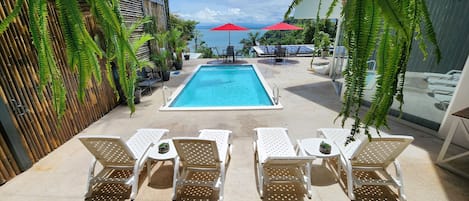 Suite 4 Pool Ocean View | Minibar, in-room safe, individually decorated, blackout curtains