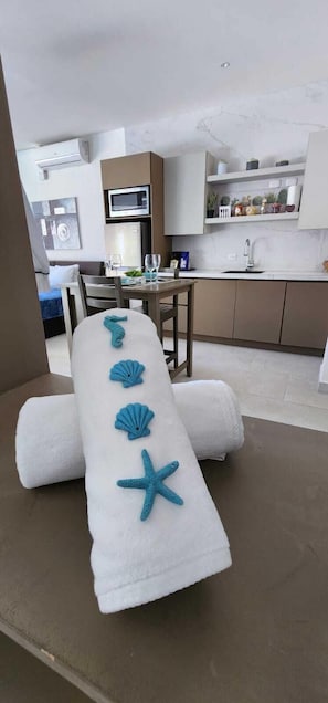 Superior Suite, Ocean View | Living area | Smart TV