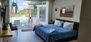 Superior Suite, Ocean View | Minibar, in-room safe, individually decorated, blackout curtains