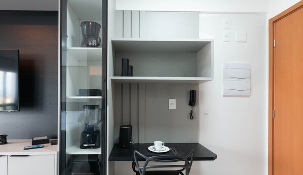 A compact kitchen with a coffee maker, a blender, and a phone on the counter. - ONE - Studios in Piata, 230m From the Beach (Salvador)