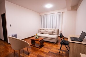 Deluxe Apartment, 2 Bedrooms | Living area | 32-inch Smart TV with digital channels