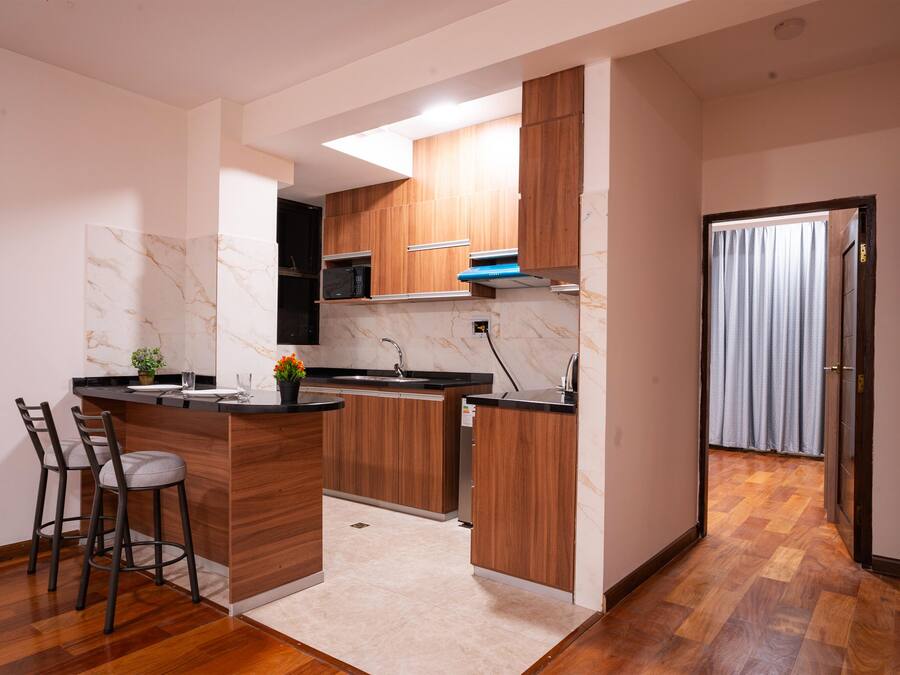 Deluxe Apartment, 2 Bedrooms | Private kitchen | Mini-fridge, microwave, stovetop, cookware/dishes/utensils