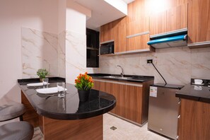 Deluxe Apartment, 2 Bedrooms | Private kitchen | Mini-fridge, microwave, stovetop, cookware/dishes/utensils