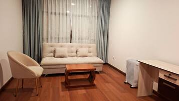 Comfort Apartment | Living area | 32-inch Smart TV with digital channels