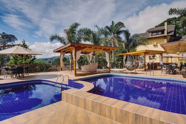 2 outdoor pools, open 8:00 AM to 8:00 PM, pool umbrellas, pool loungers