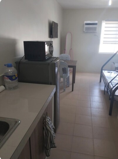 Remarkable and Radiant  1-bedroom condo in lovely Dumaguete City with AC