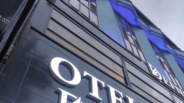 The exterior of a hotel with the name "OTEL DEFNE" prominently displayed on the facade. - DEFNE OTEL  (Polatli)