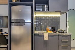 Fridge, microwave, stovetop, coffee/tea maker