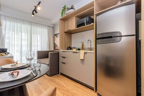 Fridge, microwave, stovetop, cookware/dishes/utensils