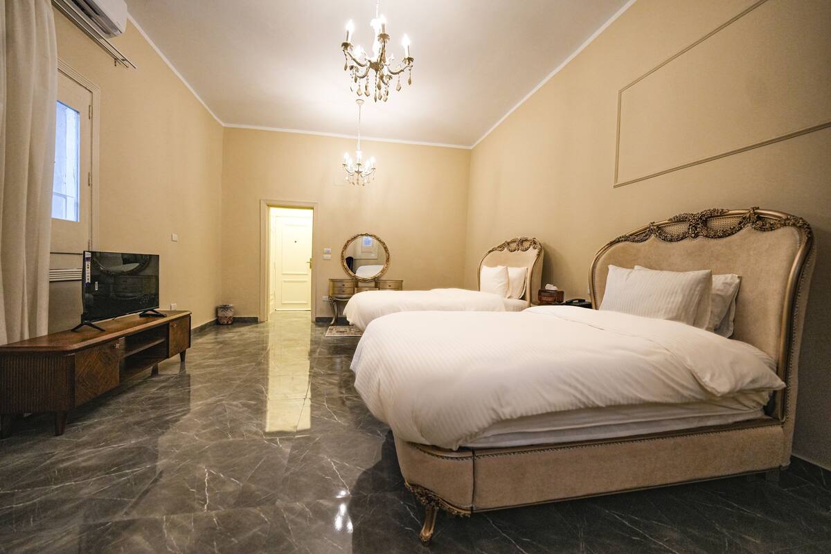 Deluxe Twin Room, Pool View | In-room safe, blackout drapes, soundproofing, iron/ironing board