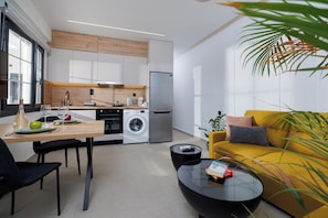 Comfort Apartment, Kitchen, City View | Living area | 40-inch flat-screen TV with cable channels