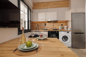 Comfort Apartment, Kitchen, City View | Private kitchen | Full-size fridge, microwave, oven, stovetop