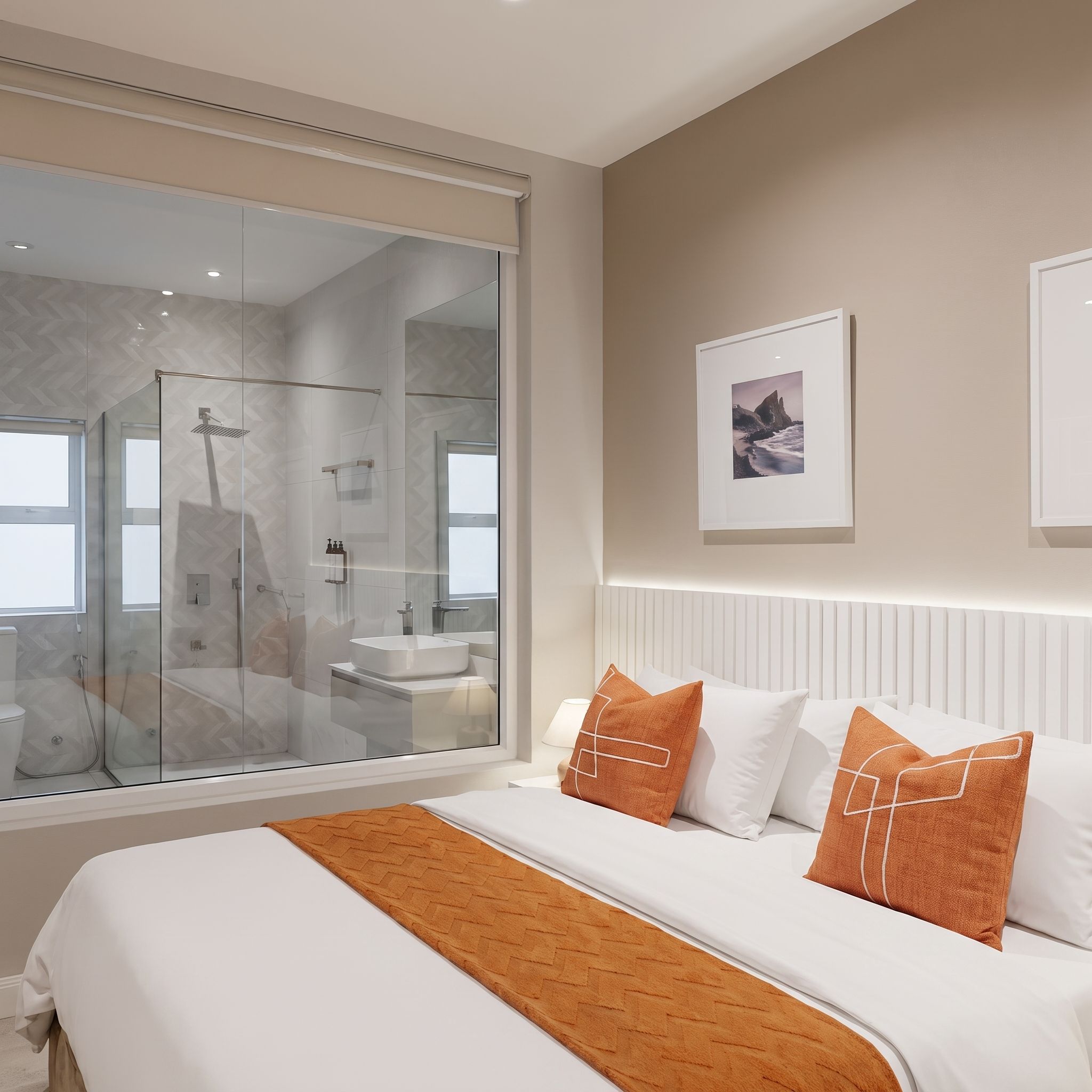 A modern bedroom with a large bed, a glass shower enclosure, and a framed picture on the wall.