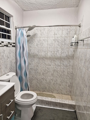 Shower, hair dryer, towels, soap