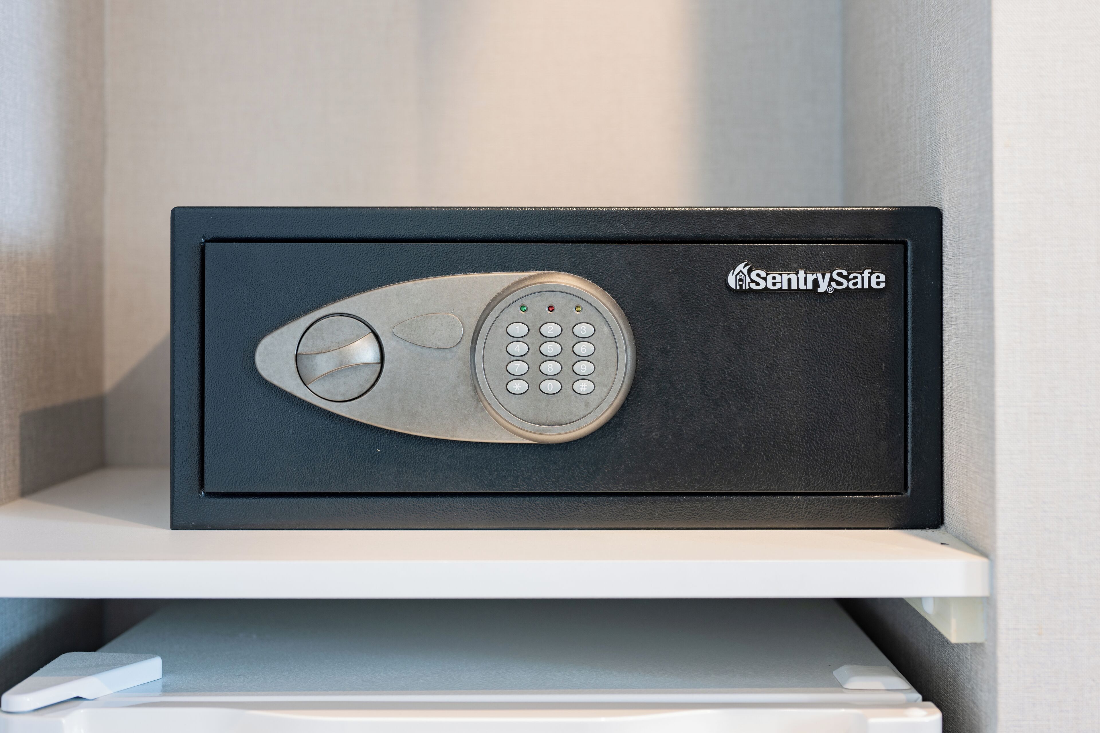 A black safe with a keypad and a circular lock mechanism, labeled "SentrySafe."
