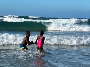 On the beach, white sand, beach towels