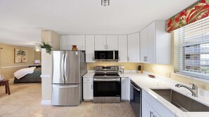 Coffee/tea maker, toaster, dining tables