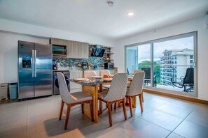 Fridge, stovetop, dishwasher, coffee/tea maker
