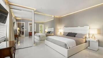 Premium bedding, down comforters, blackout drapes, iron/ironing board