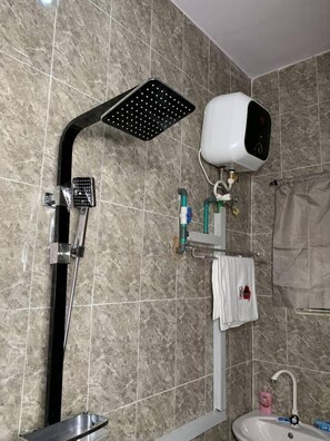 Shower, towels, soap, toilet paper
