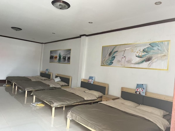 Comfort Quadruple Room, City View | Living area | Computer monitors