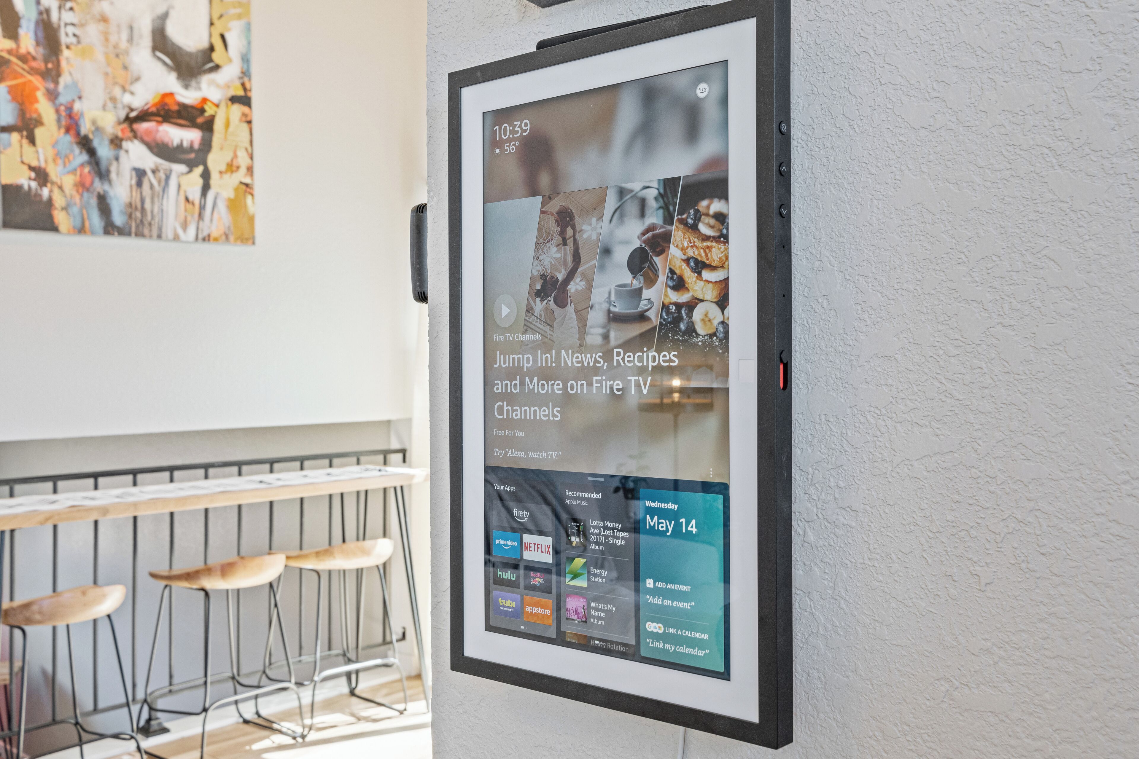 A digital display advertising Fire TV Channels with a menu of apps and a date of May 14.