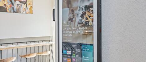 A digital display advertising Fire TV Channels with a menu of apps and a date of May 14.