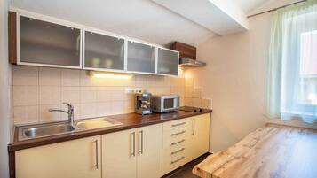 Fridge, microwave, stovetop, coffee/tea maker