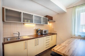 Fridge, microwave, stovetop, coffee/tea maker