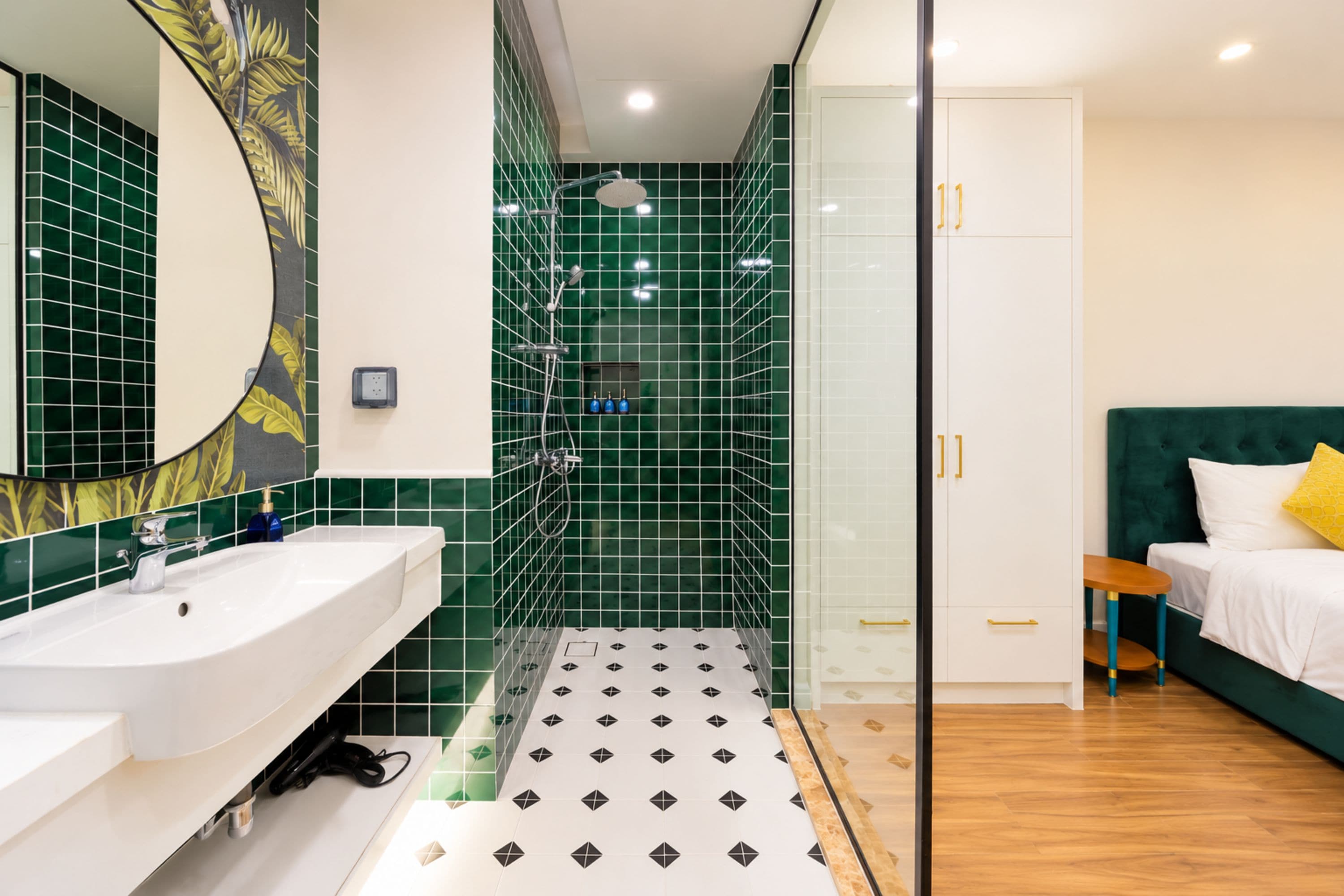 A modern bathroom with a shower, a sink, and a mirror.
