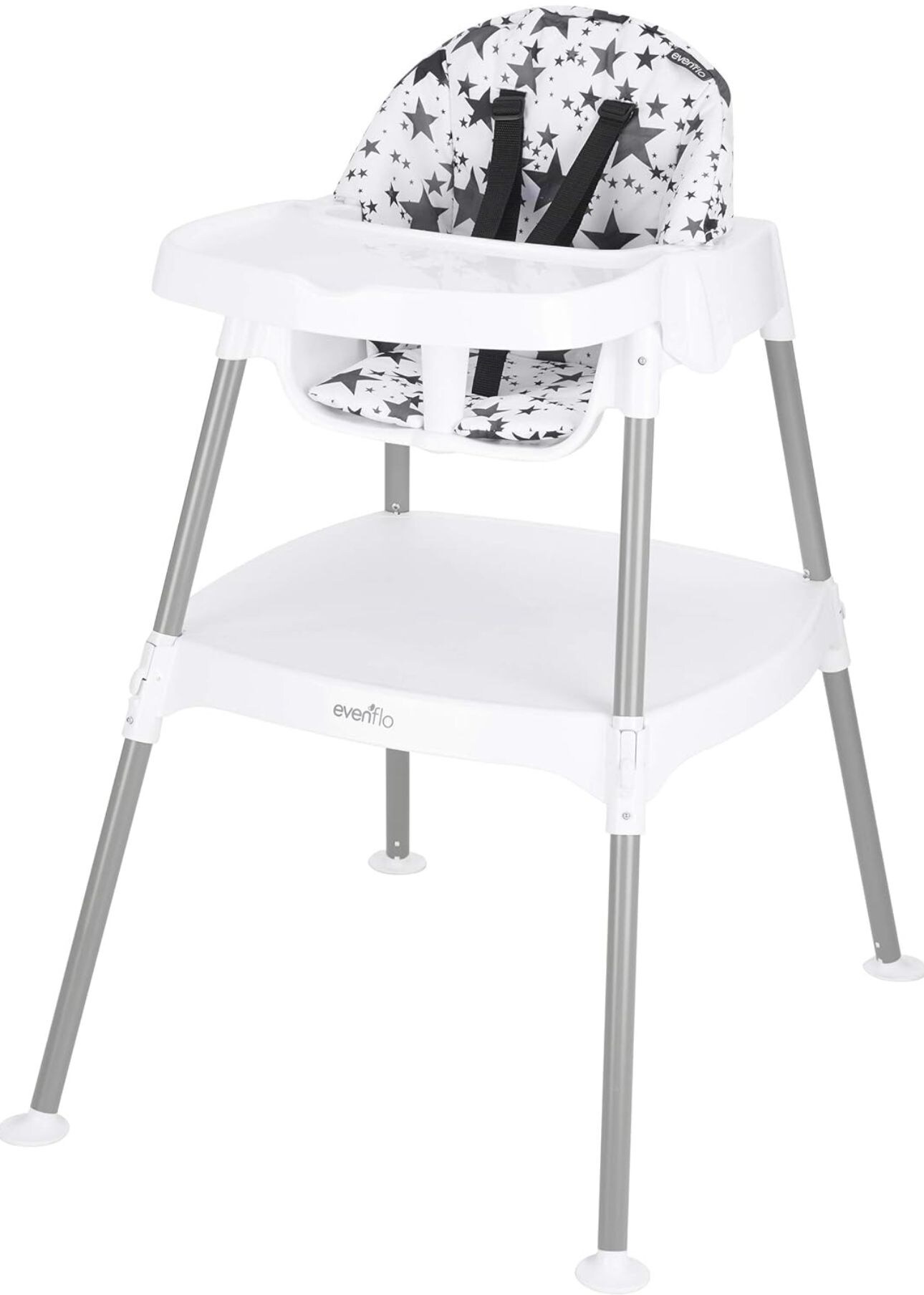 Un seggiolone bianco con motivo a stelle e gambe in metallo.