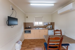 Standard Cabin | Living area | 32-inch flat-screen TV with digital channels