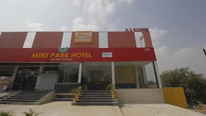 The exterior of the Mint Park Hotel with a sign indicating 5-star toilets are available. - HOTEL MINT PARK (Balanagar)