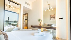A hotel room with two beds, a large window with a city view, a modern chandelier, and a minimalist decor. - Canal and Burj Khalifa Views, Mins Drive to Downtown Dubai (Dubai)