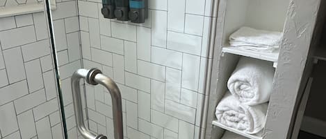 Shower, hair dryer, towels, soap