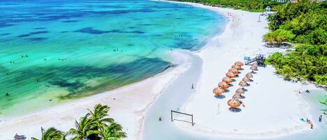 On the beach, sun loungers, beach towels