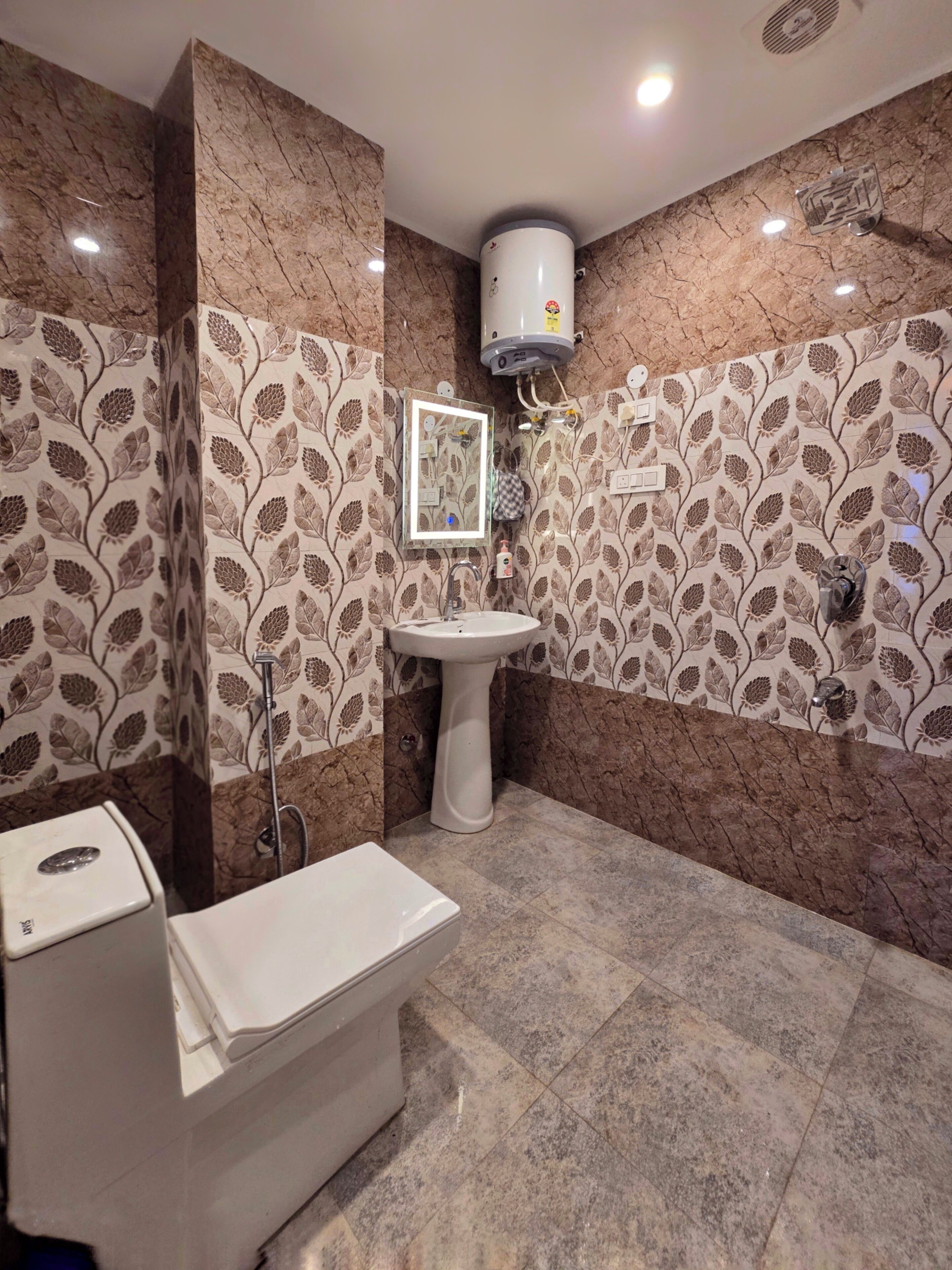 A bathroom with a toilet, sink, and shower.