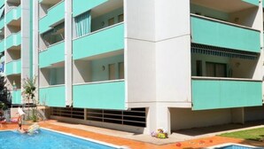 A multi-story building with a swimming pool.