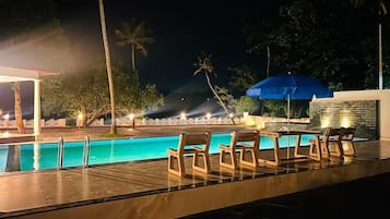 Outdoor pool, open 6:00 AM to midnight, pool umbrellas