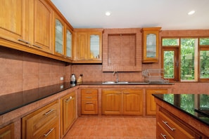 Villa | Private kitchen | Full-sized fridge, microwave, oven, stovetop