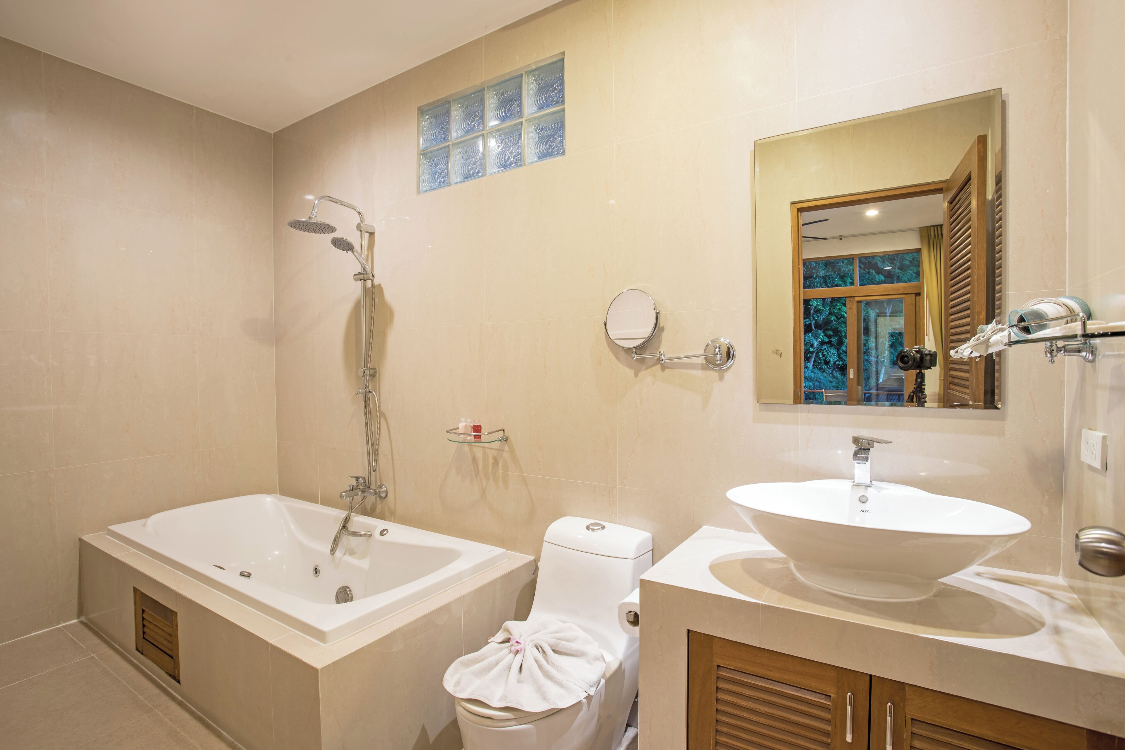 A bathroom with a bathtub, a toilet, a sink, and a shower.
